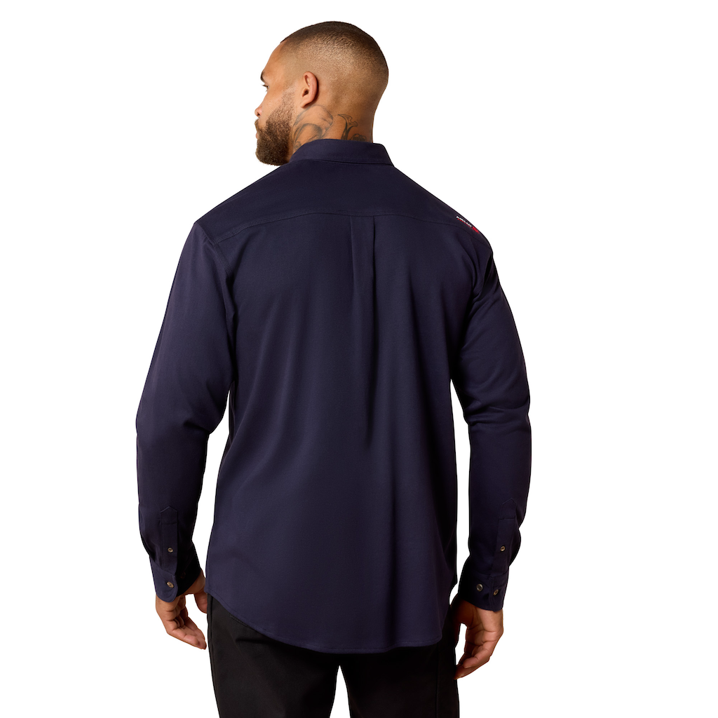Man wearing a navy blue long sleeve work shirt, viewed from the back