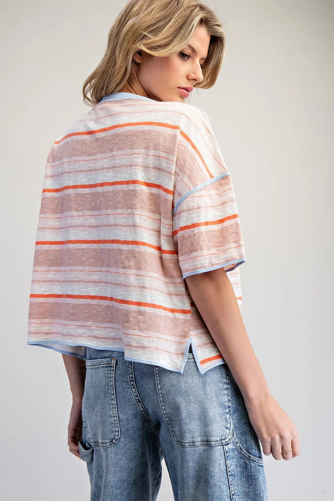 Boxy t-shirt features a multi tonal horizontal stripe pattern