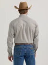 Man in cowboy hat wearing gray long sleeve shirt and blue jeans, back view