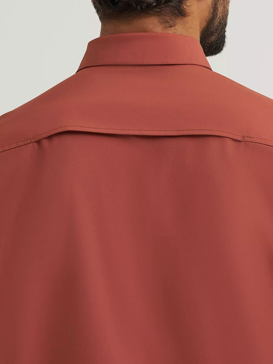 A hidden snap‑down collar stays neatly in place, while two chest flap pockets