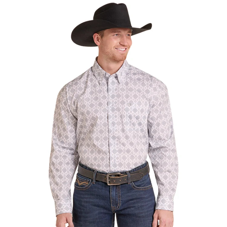 A man wearing a light gray and white patterned western long-sleeve button-down shirt, dark blue jeans, a brown belt, and a black cowboy hat, shown against a plain white background.