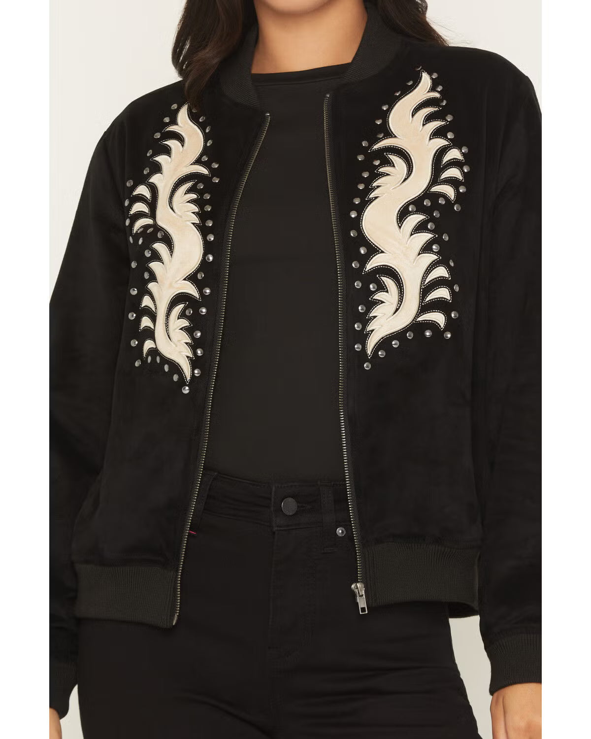 Black bomber jacket with cream embroidered detail and silver studs on front