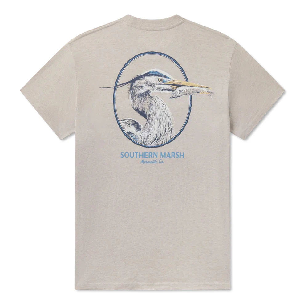 graphic on the back of a heron framed within a circular emblem with a fish in the beak