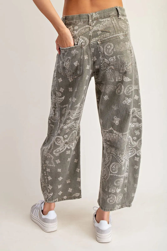 front and back pockets, and visible seam paneling through the legs, finished with belt loops and a button closure