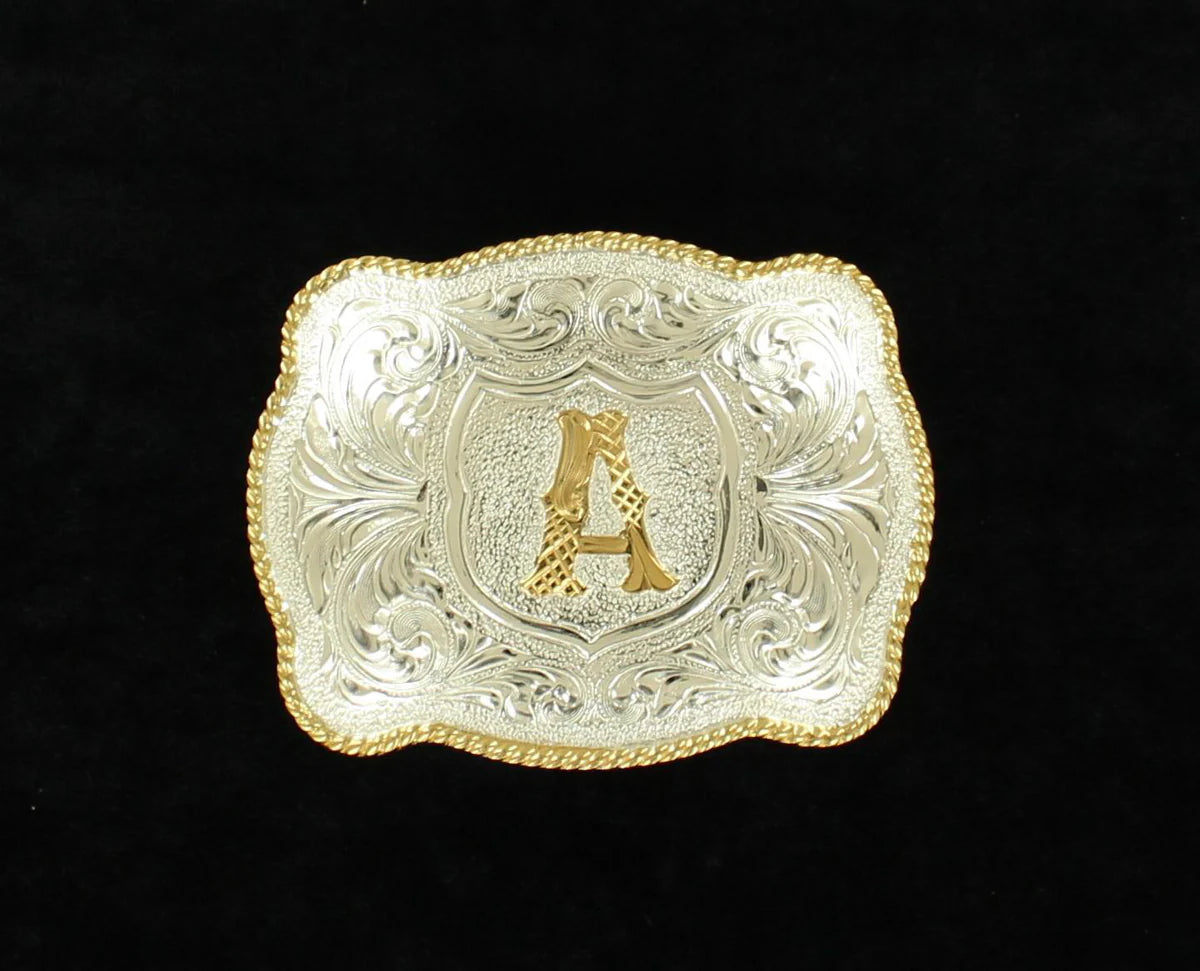 Silver and gold western belt buckle with ornate scrollwork and engraved letter A on black background