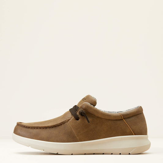 Brown suede casual loafer with white sole and brown laces on a neutral background