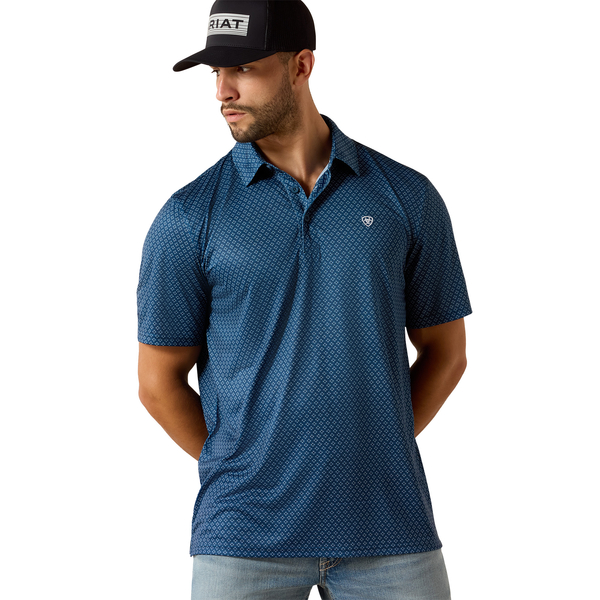 Man wearing dark denim medallion print men's polo shirt and blue jeans