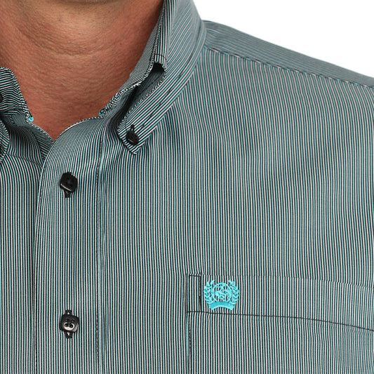 Close-up of striped button-down shirt with turquoise embroidered chest logo