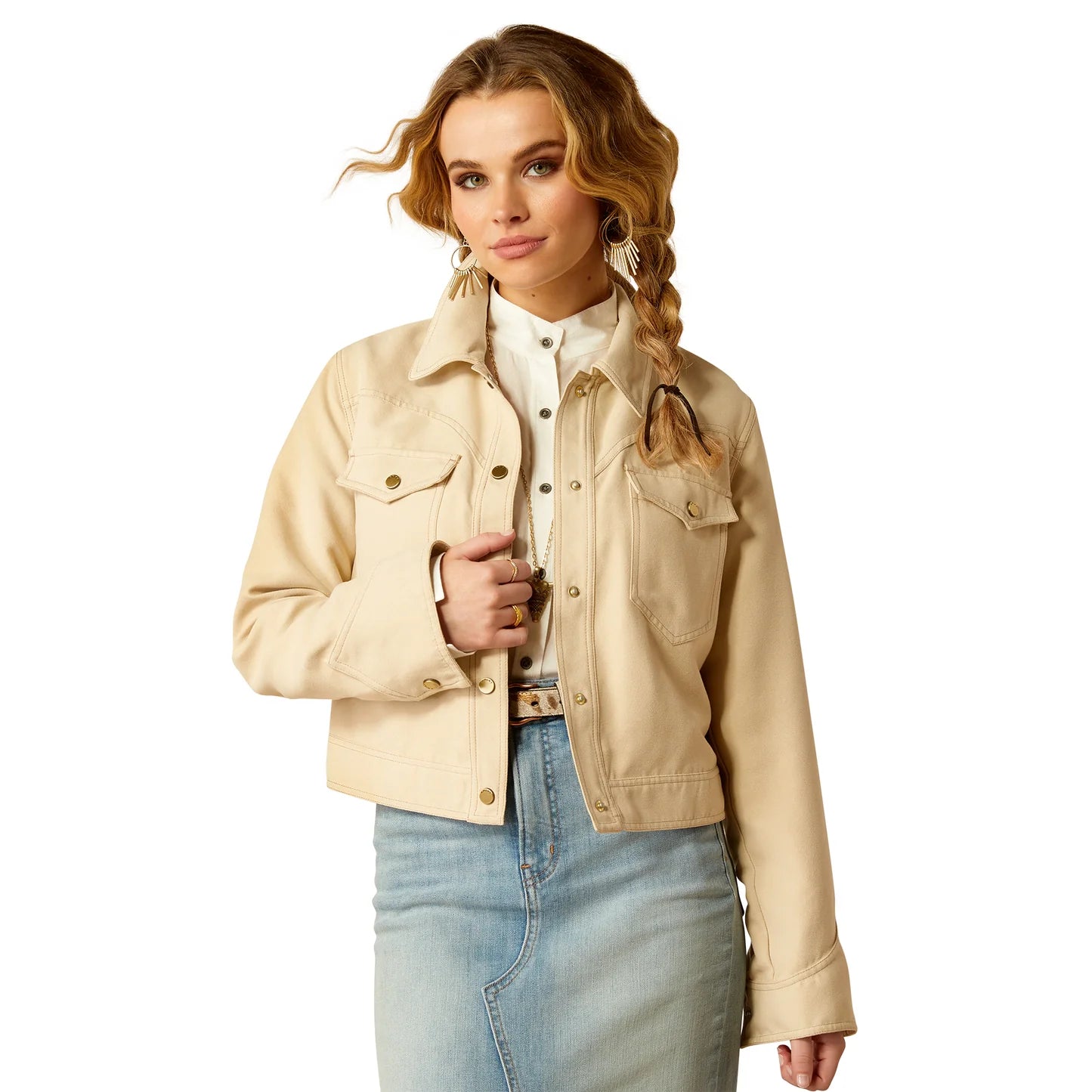 Woman wearing a cream western-style denim jacket with button-up front and light wash skirt