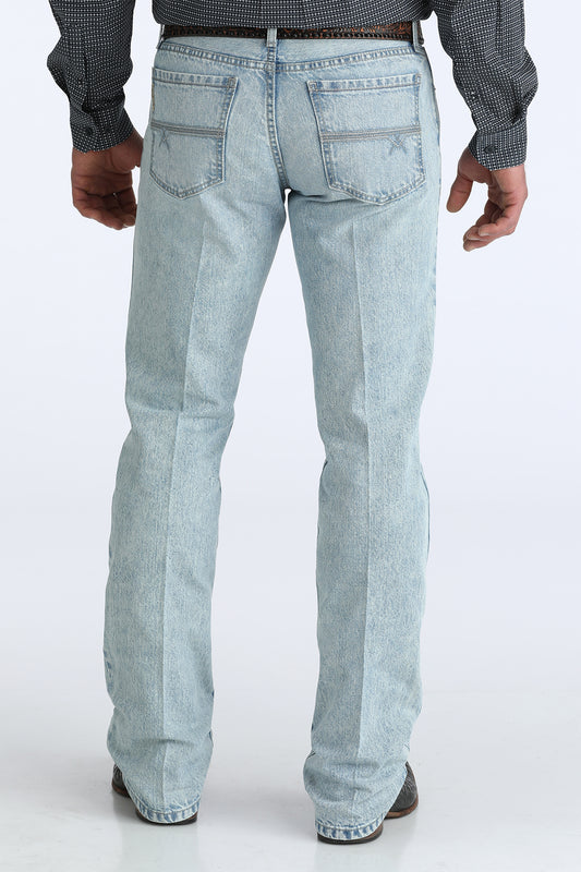 Light blue jeans worn by a person on a white background