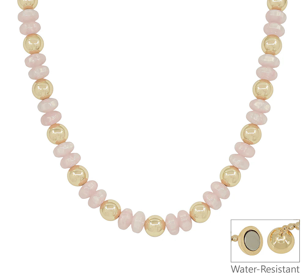 Pink and gold beaded necklace with water-resistant feature and round clasp detail