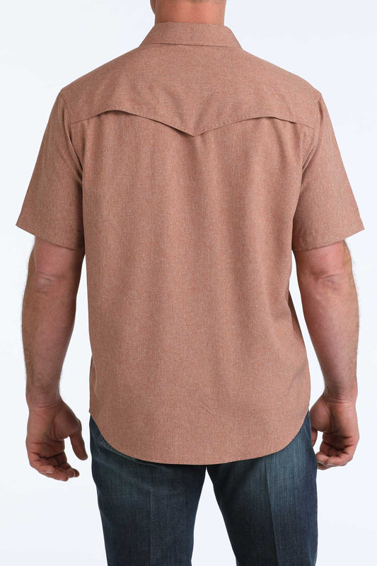 Brown short-sleeve shirt worn by a person on a white background