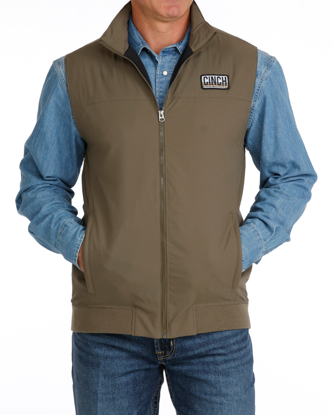 green vest with CINCH logo