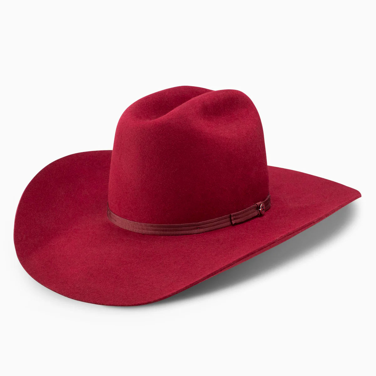 Red felt cowboy hat with wide brim and decorative hatband on white background
