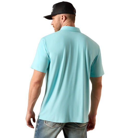 Man wearing a light blue polo shirt and black cap on a white background