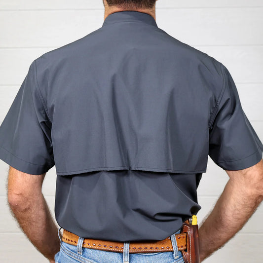 Person wearing a gray short-sleeve shirt with a white background