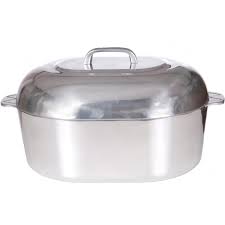Large stainless steel roasting pan with lid and side handles on a white background