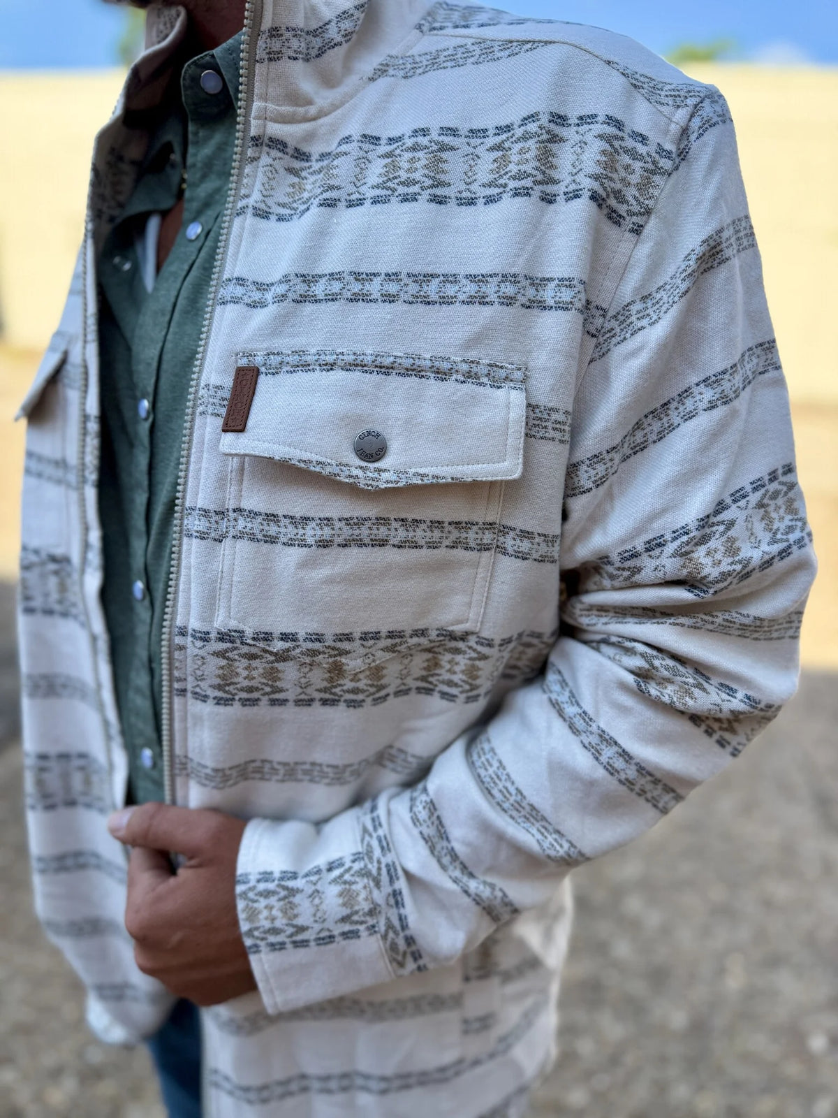 Off white Jacket with tan background