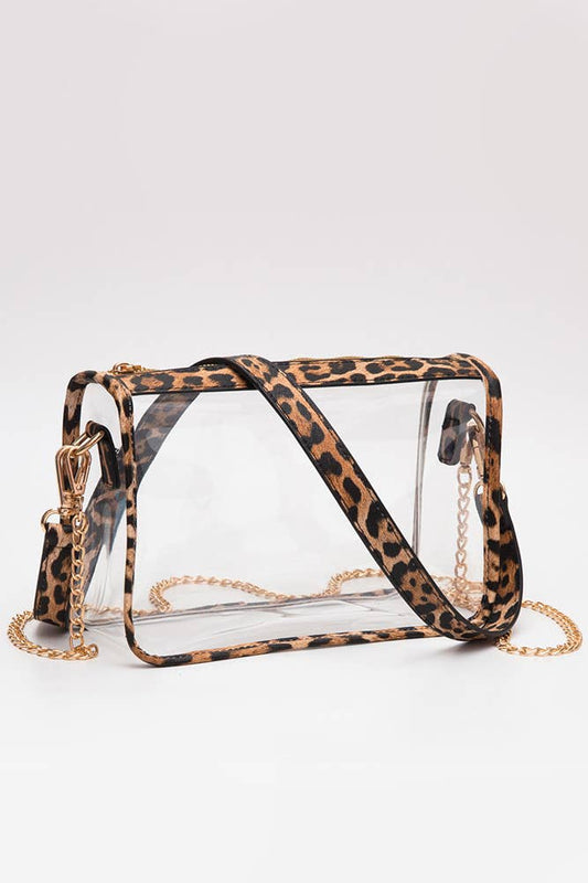 Clear handbag with leopard print strap on a white background