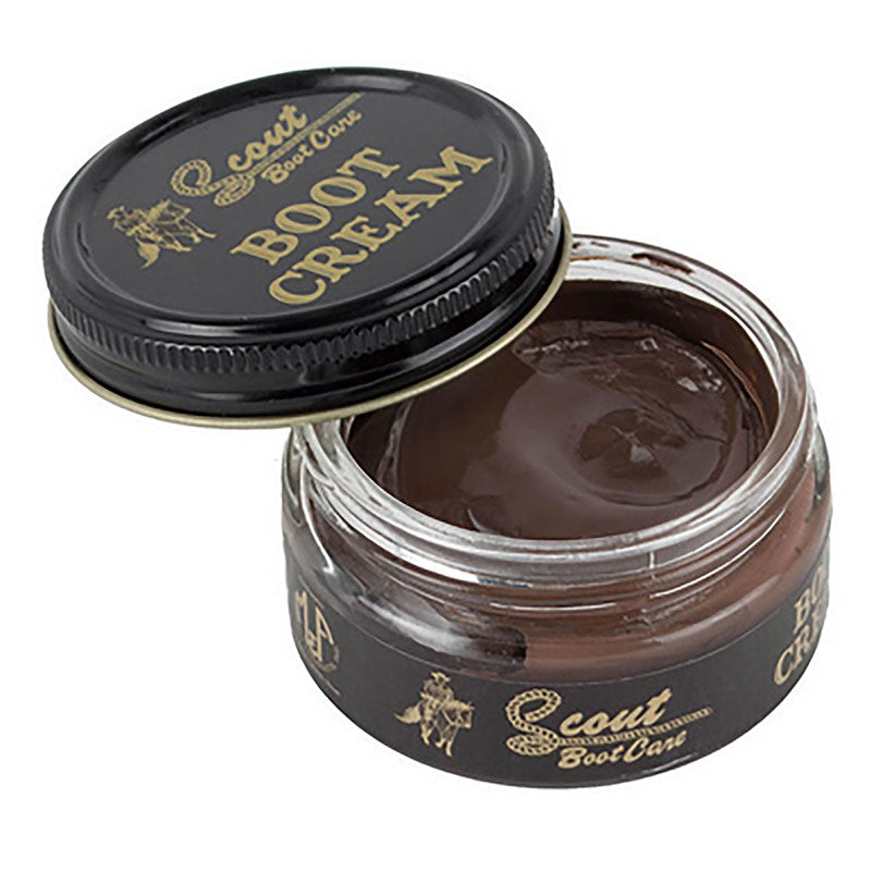 Open jar of Scout Boot Cream with black lid on a white background