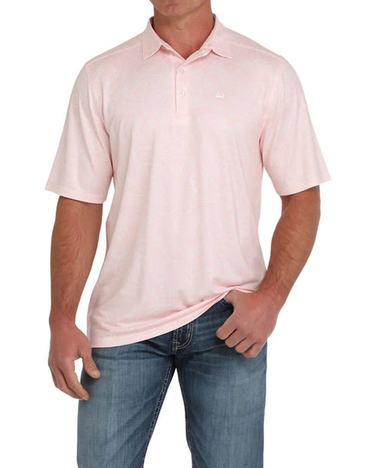 Light pink short sleeve polo shirt with subtle pattern, worn with blue jeans