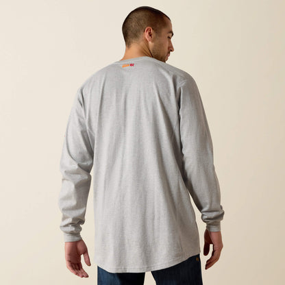 Man wearing a gray long-sleeve shirt with a logo on the back against a beige background