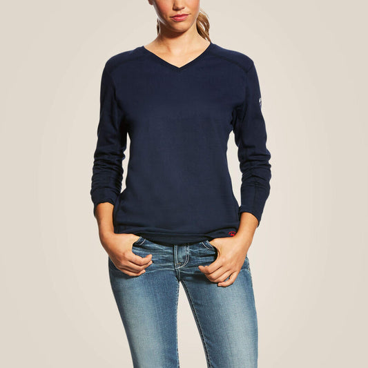 Woman wearing Ariat FR AC navy V-neck long-sleeve work top