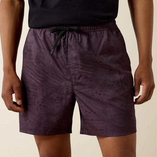 man wearing grey shorts with print on white background
