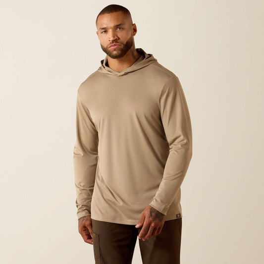 Man wearing a beige hoodie against a plain background