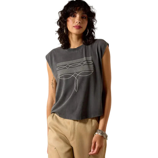 Woman wearing a gray sleeveless top with a geometric design on a white background