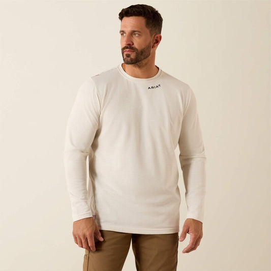 Man wearing a white long-sleeve shirt with a brand logo on a beige background