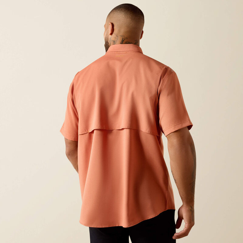 Back view of man wearing short sleeve peach casual shirt with vented back panel