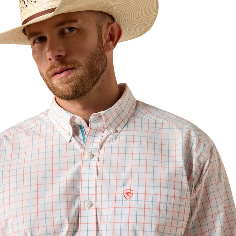 Man wearing a white plaid button-down shirt and cowboy hat, western style outfit.