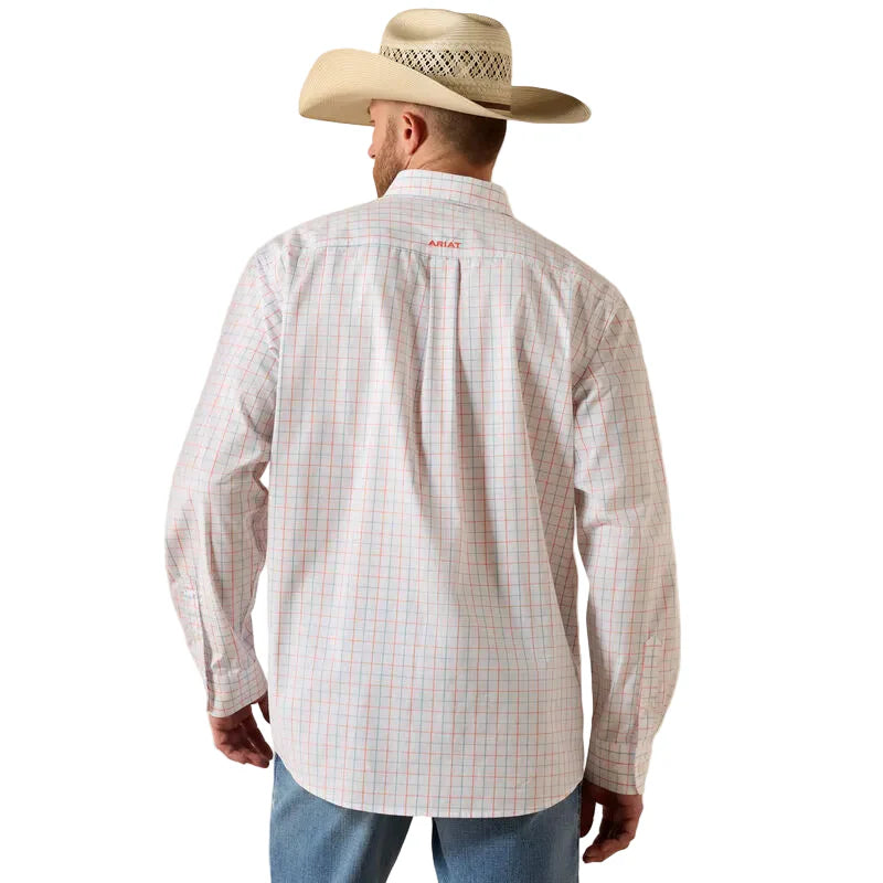 Man in cowboy hat wearing long sleeve plaid western shirt and blue jeans, back view