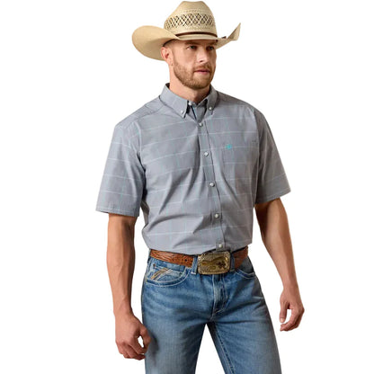 Man wearing a gray checkered shirt, blue jeans, and a straw hat on a white background