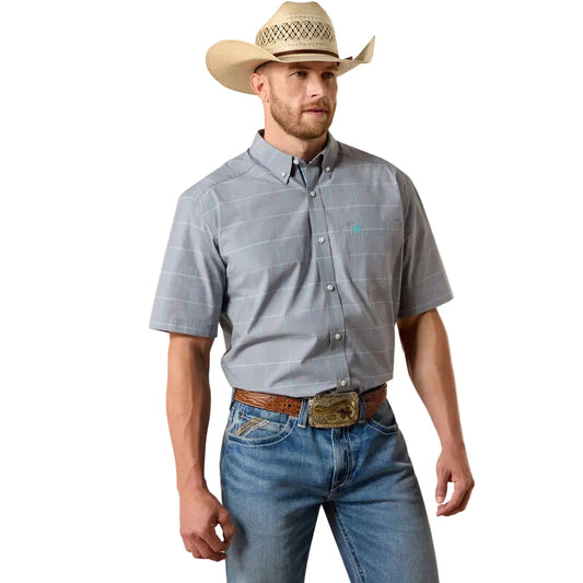 Man wearing a gray checkered shirt, blue jeans, and a straw hat on a white background