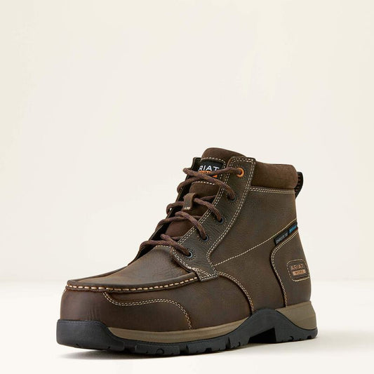Brown leather boot with black sole on a light beige background