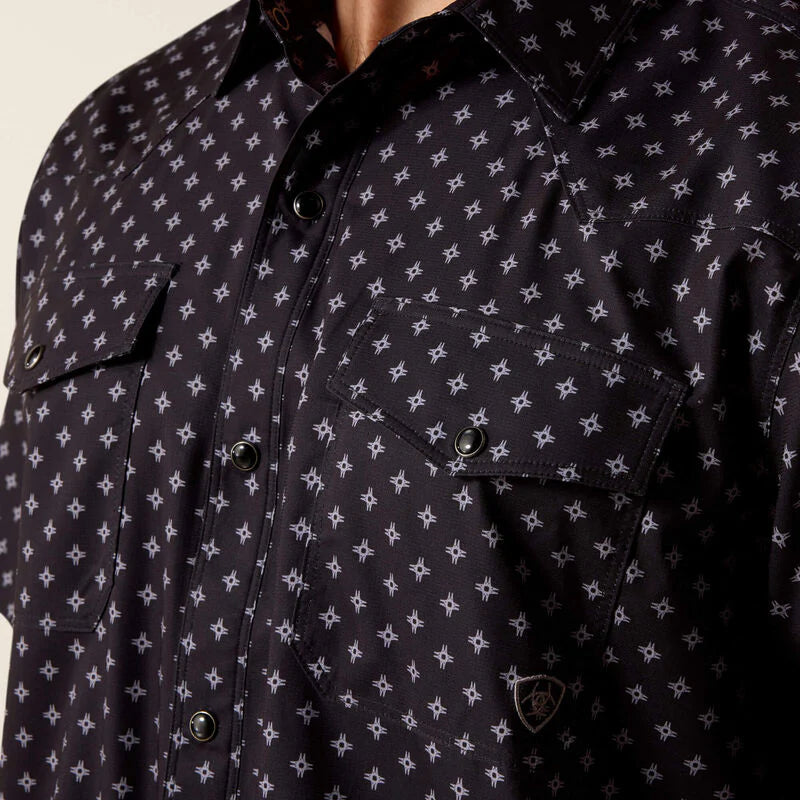 Navy blue shirt with white star pattern on a beige background