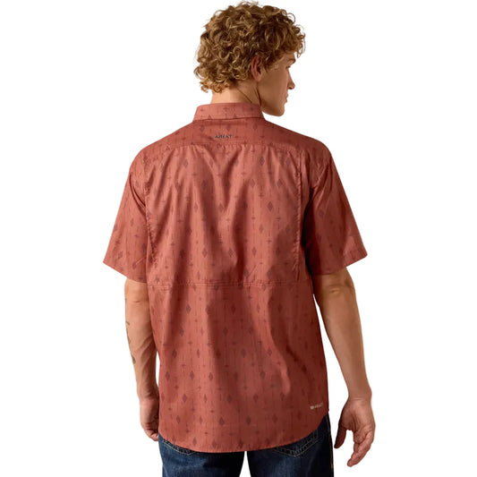 Man wearing a red patterned shirt on a white background