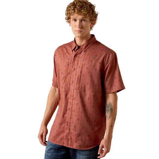 Man wearing a red patterned shirt on a white background