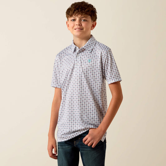 Young boy wearing a patterned shirt against a plain background
