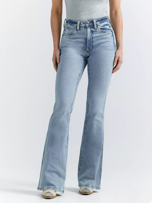 Woman wearing light wash high-waisted flare jeans and a gray tank top