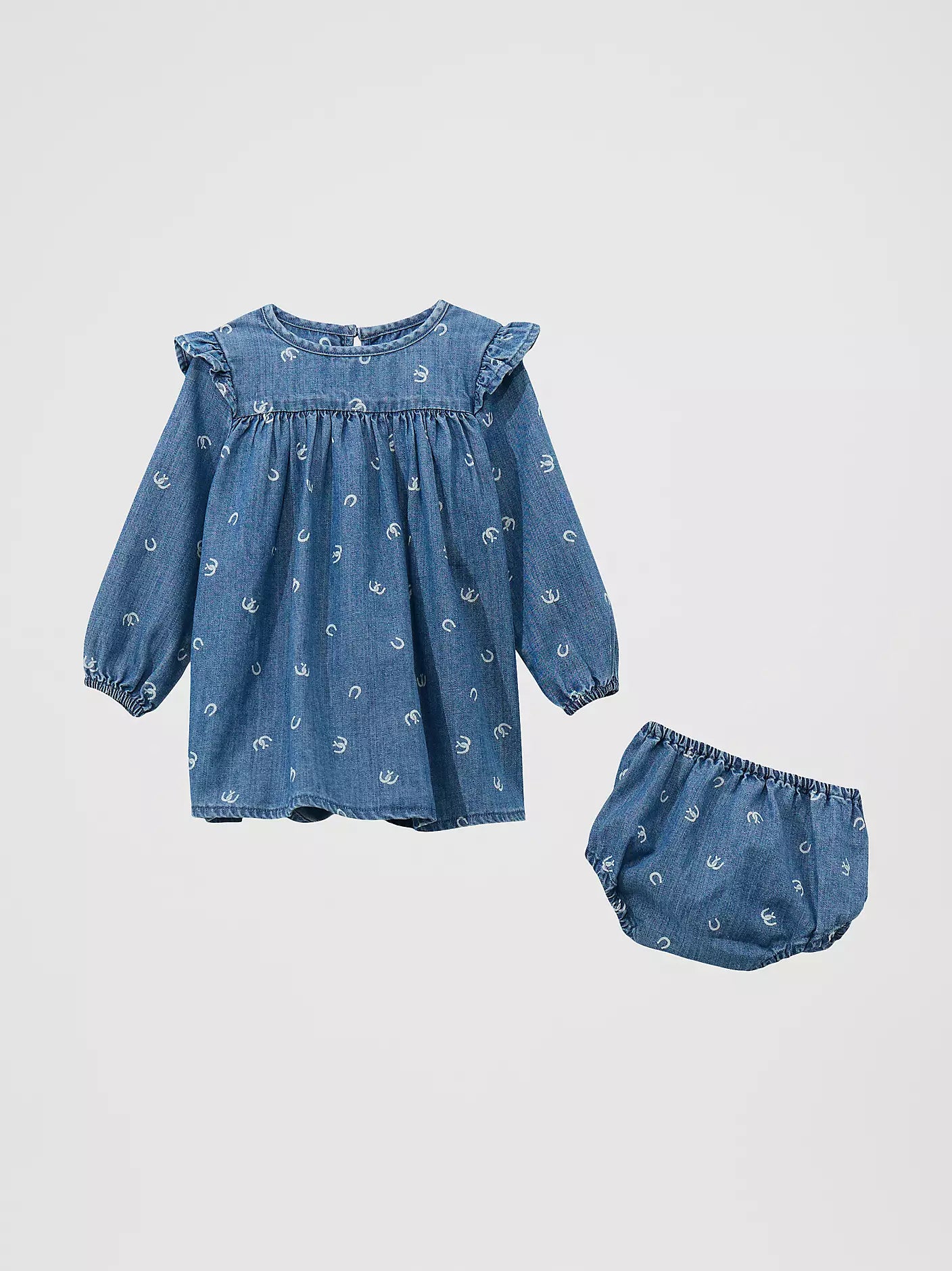 Blue denim baby dress with long sleeves, ruffle shoulders, horseshoe print, and matching bloomers.
