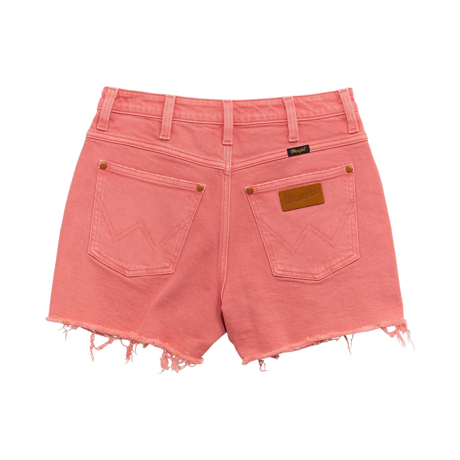 Back view of pink denim cutoff shorts with frayed hems and back pockets