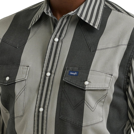 Close-up of a black and gray checkered shirt with a visible brand logo.