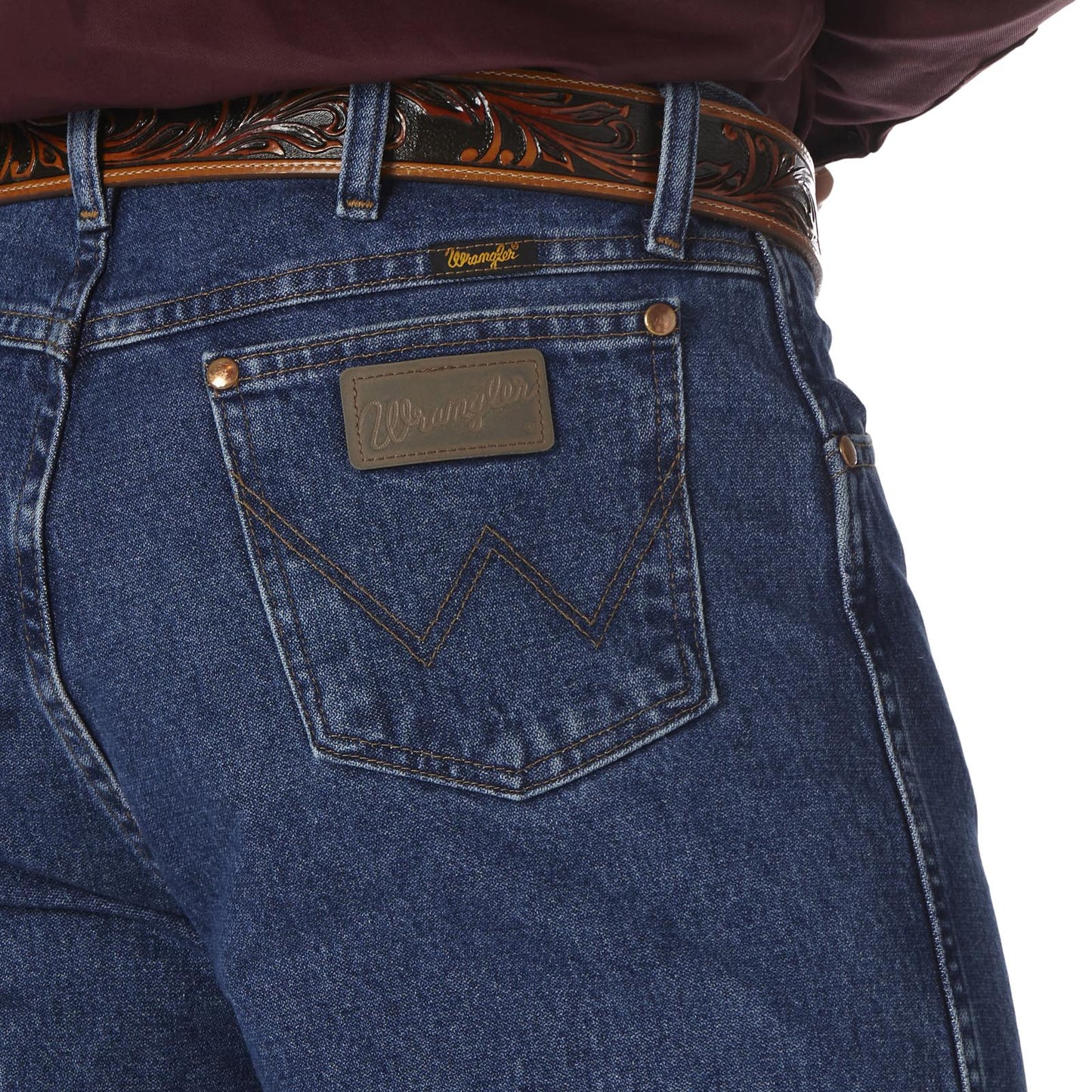 Close-up of blue jeans with a brand logo on the pocket against a white background