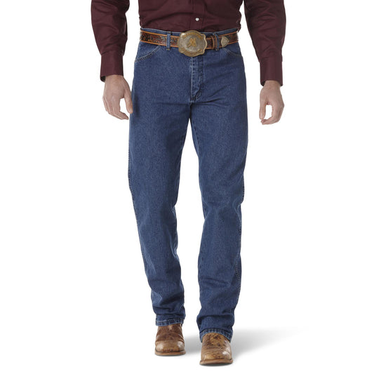 Man wearing blue jeans with a brown belt and shirt on a white background