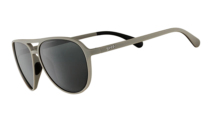 Sunglasses with metallic frame and dark lenses on a white background