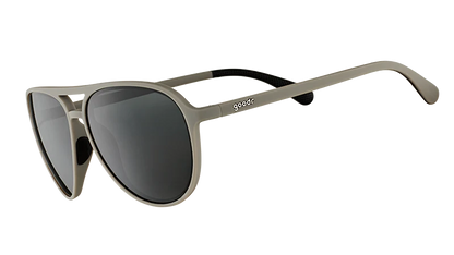 Sunglasses with metallic frame and dark lenses on a white background