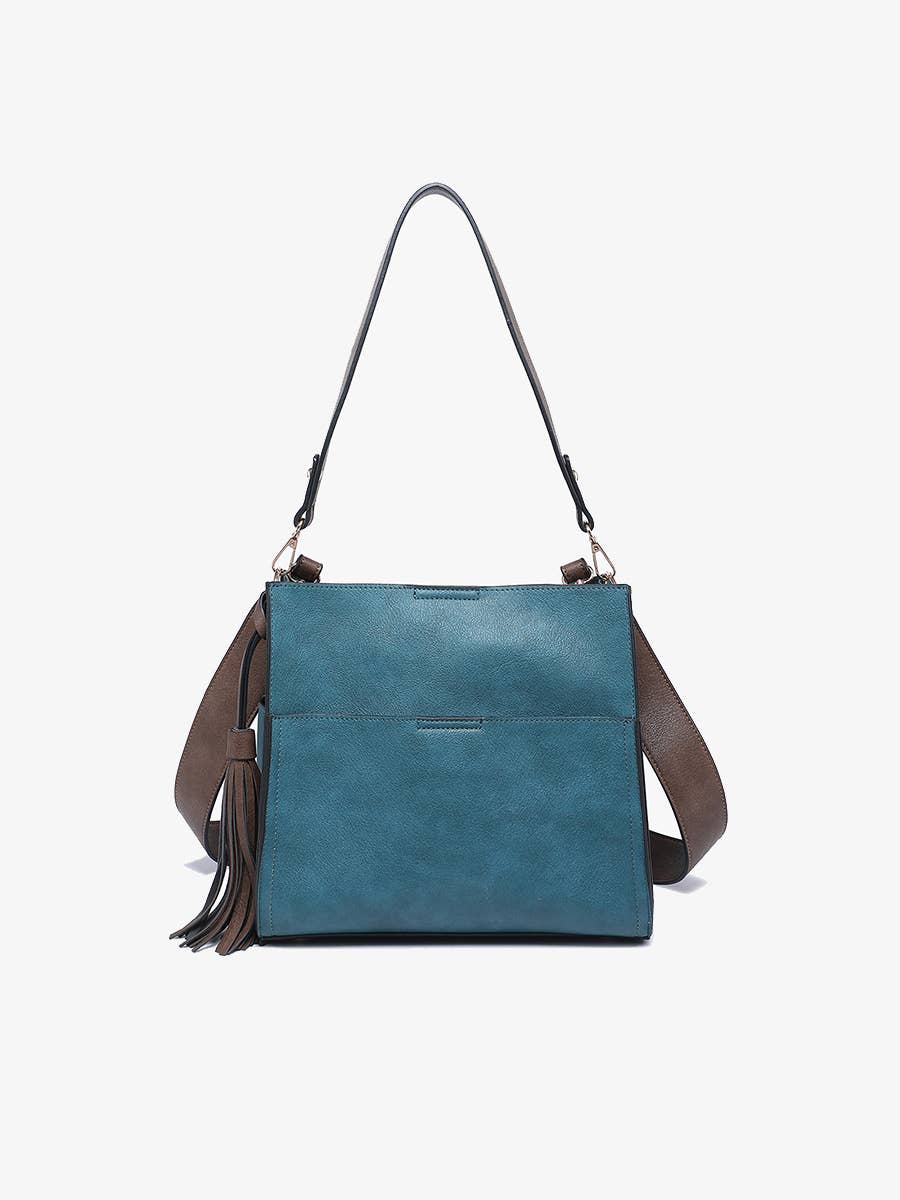 Blue handbag with brown strap and tassel on a white background